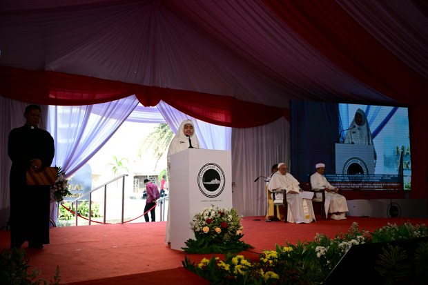Pope Francis (2nd R) and Grand Imam of Istiqlal Mosque Nasaruddin Umar (R) attend an interreligious meeting with religious leaders at the Istiqlal Mosque in Jakarta on September 5, 2024.