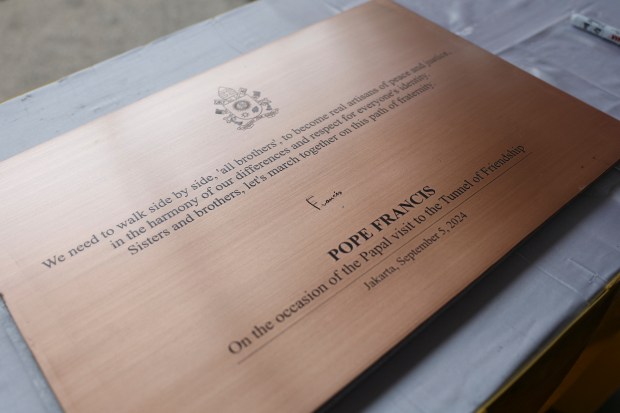 This photo shows a general view of a plaque signed by Pope Francis during his visit to the tunnel of friendship that connects the Istiqlal Mosque and the Jakarta Cathedral in Jakarta on September 5, 2024.
