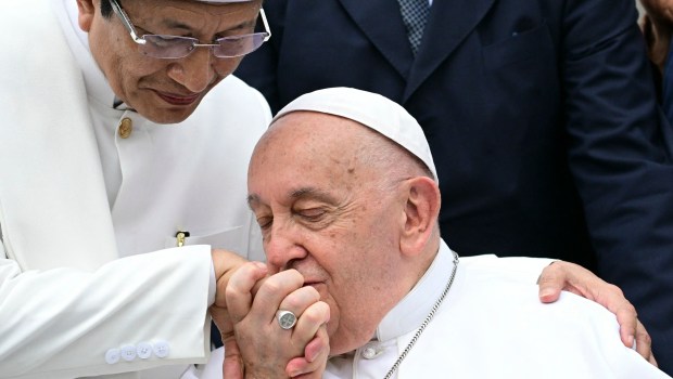 Grand Imam of Istiqlal Mosque Nasaruddin Umar (L) interacts with Pope Francis after an interreligious meeting with religious leaders at the Istiqlal Mosque in Jakarta on September 5, 2024.