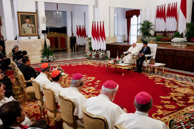 Pope Francis (L) and Indonesia's President Joko Widodo attend a meeting with Indonesian authorities, civil society and the diplomatic corps at the Presidential Palace in Jakarta on September 4, 2024, during his apostolic visit to Asia.