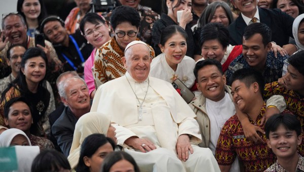 Pope Francis poses with young people of Scholas Occurrentes at Grha Pemuda Youth Centre in Jakarta on September 4, 2024.