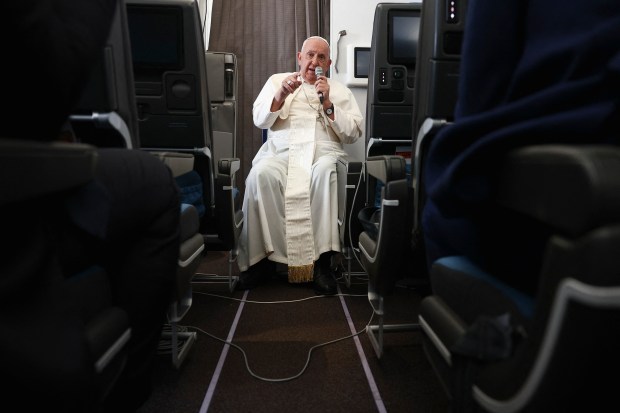Pope Francis holds a news conference aboard the papal plane on his flight back after his 12-day journey across Southeast Asia and Oceania, on September 13, 2024.