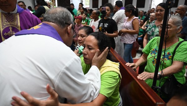 Widow at Juan Lopez funeral