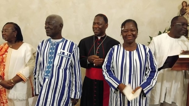 Archbishop Julien Kaboré flanked by his father, his sister, and official representatives of Burkina Faso, on Sept. 14, 2024 in Rome.