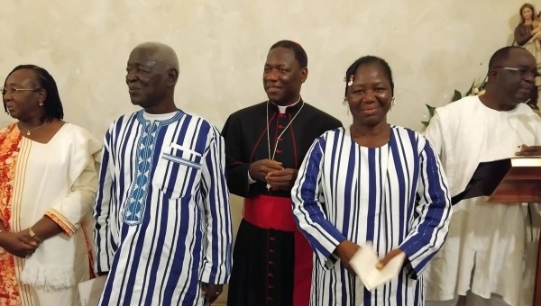 Archbishop Julien Kaboré flanked by his father, his sister, and official representatives of Burkina Faso, on Sept. 14, 2024 in Rome.