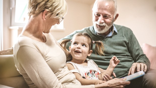 grandma-grandpa-reading-toddler-book-
