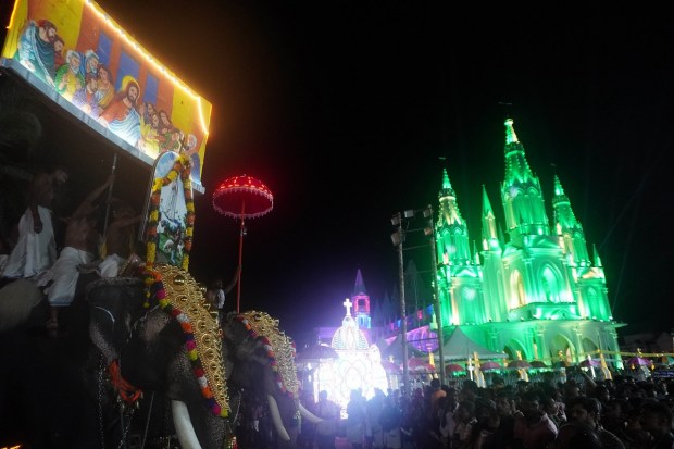 Last Supper Float with the illuminated church in background