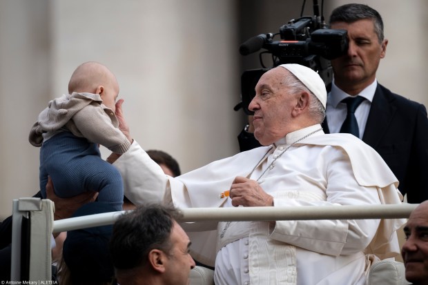 Pope Francis Blesses a child