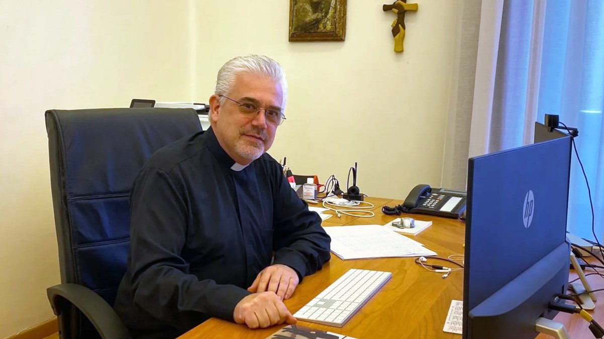 Photo of Fr. Fabio Baggio (soon-to-be cardinal) at his desk