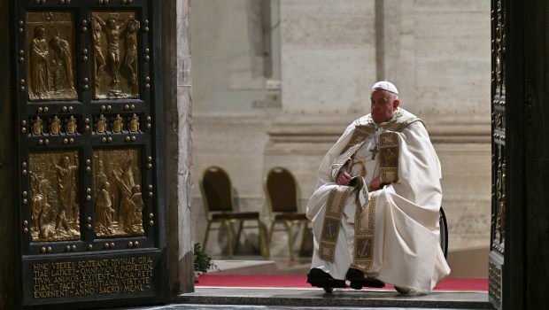 Pope Francis opens the Holy Door of St Peter's Basilica in the Vatican to mark the start of the Catholic Jubilee Year, on December 24, 2024