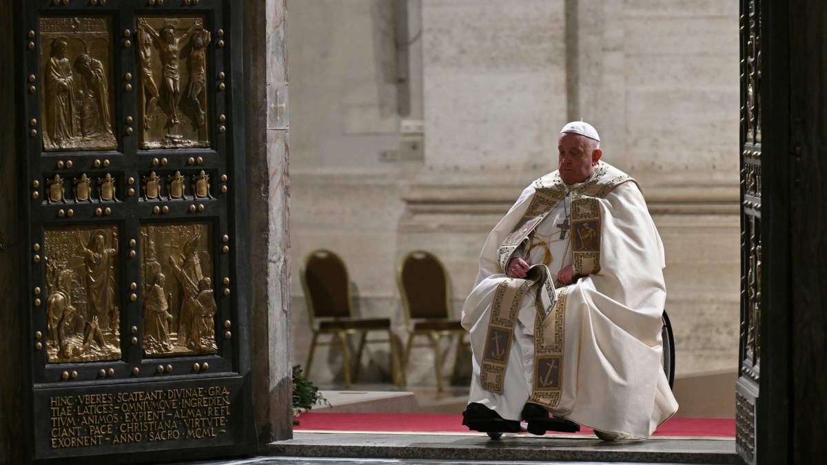 Pope Francis opens the Holy Door of St Peter's Basilica in the Vatican to mark the start of the Catholic Jubilee Year, on December 24, 2024