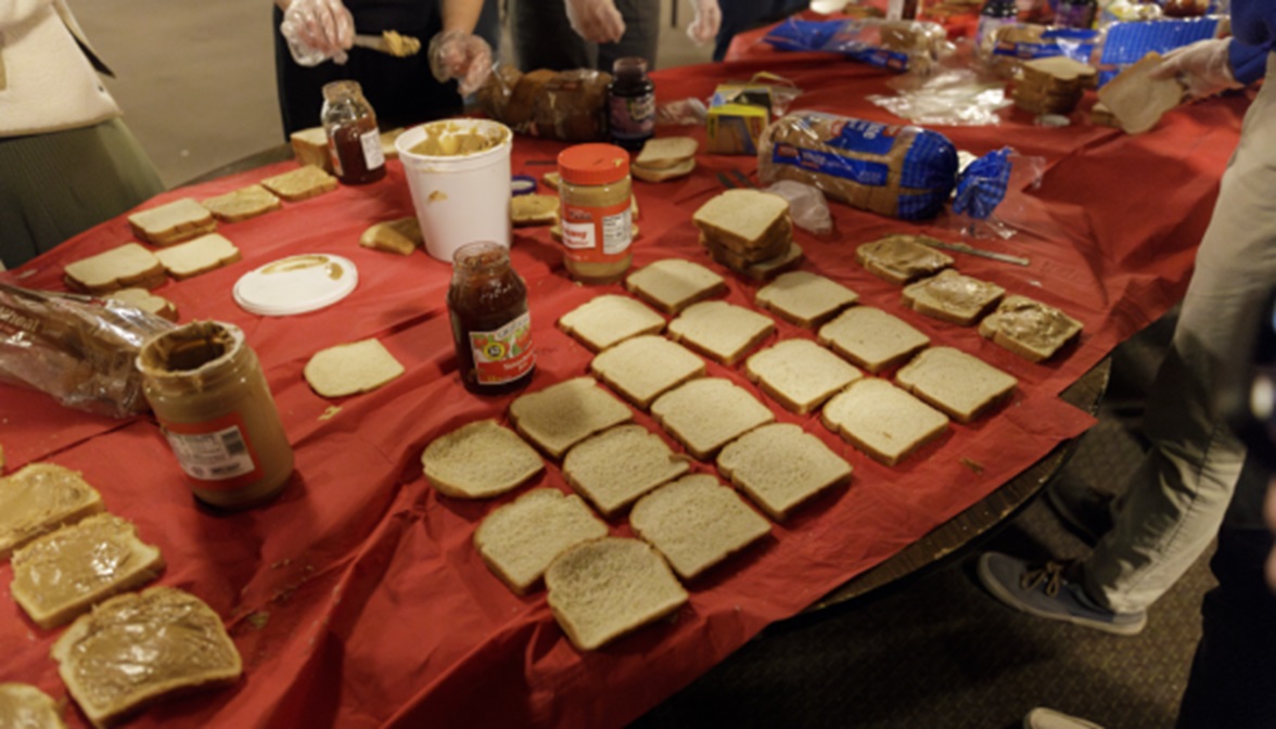 Thomas Aquinas College students making sandwiches