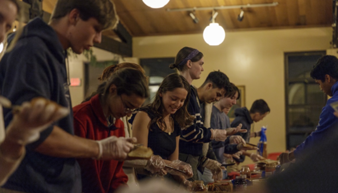 Thomas Aquinas College students making sandwiches