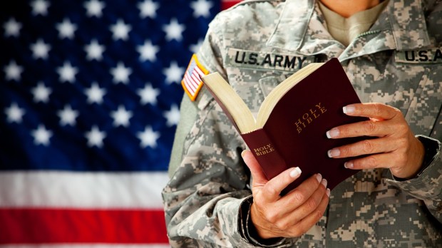 US Service Member Holds Bible