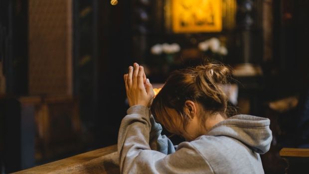 Woman praying in temple