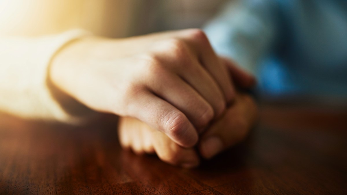 Closeup hands couple praying