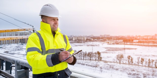 Engineer in hardhat working winter