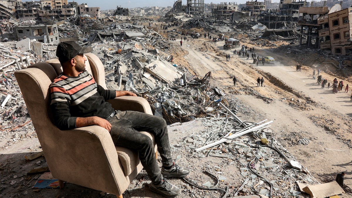 PALESTINIAN-LOOKS-AT-DESTRUCTION-OF-GAZA.jpg