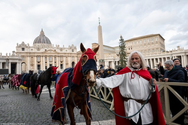 Pope Francis delivers his blessing during the Angelus prayer in St.Peter's Square at the Vatican on January 6, 2025