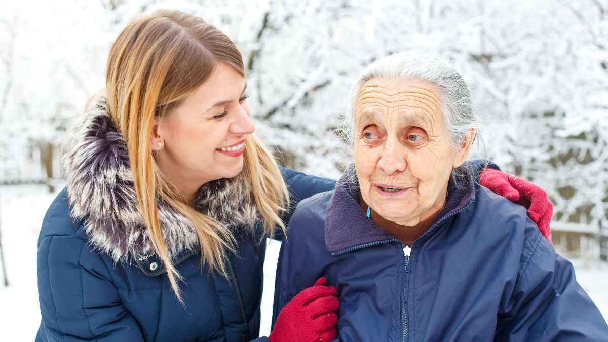 Woman with elderly woman winter