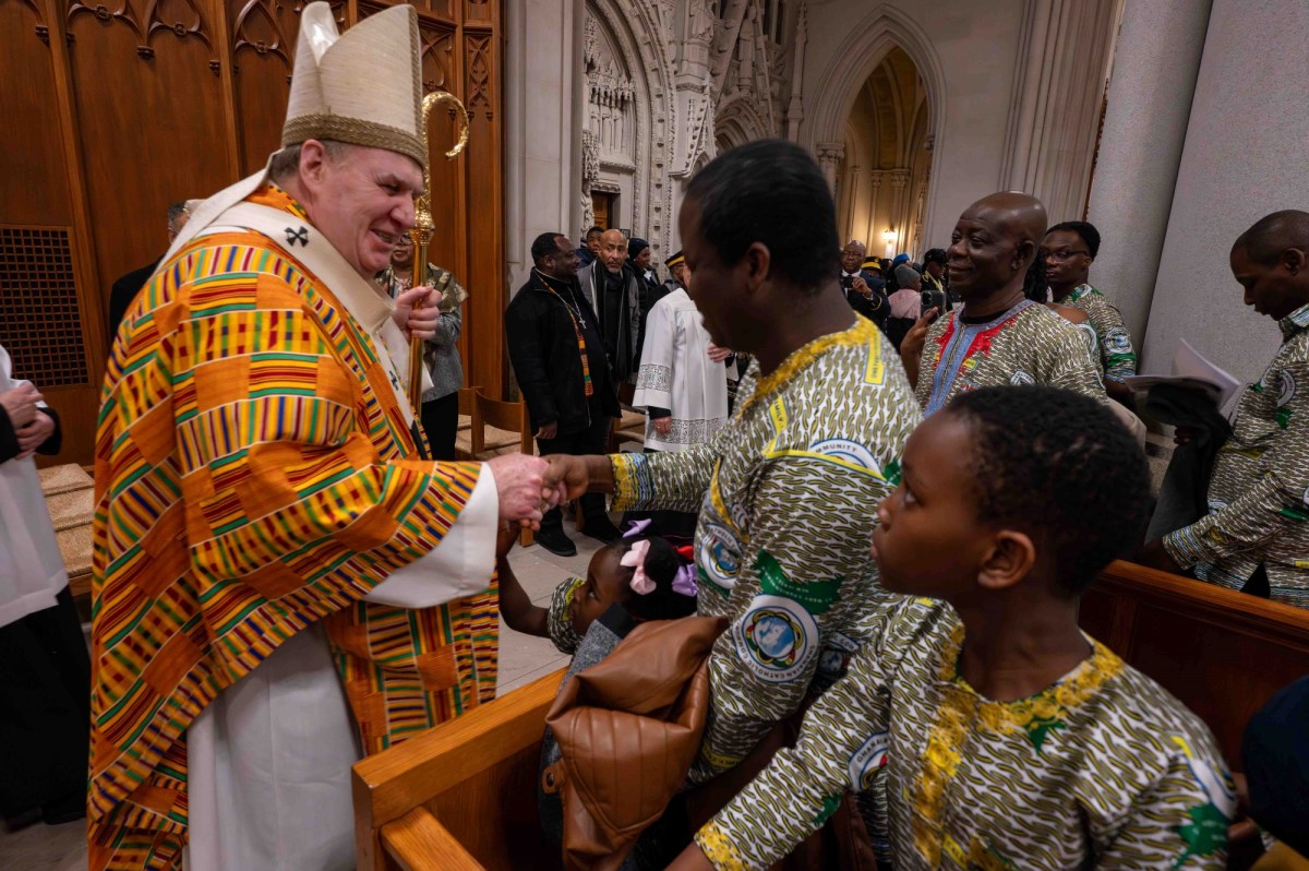 Cardinal Joseph W. Tobin greets Mass attendees