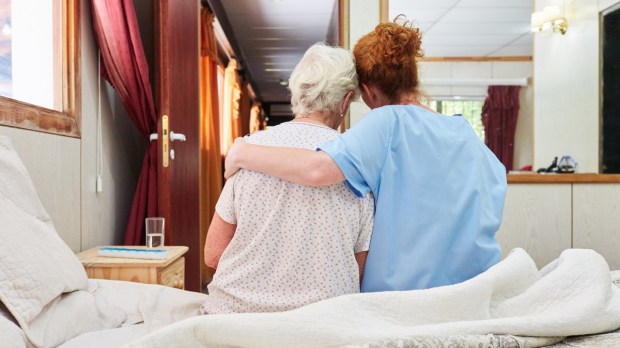 Hospice nurse with elderly patient