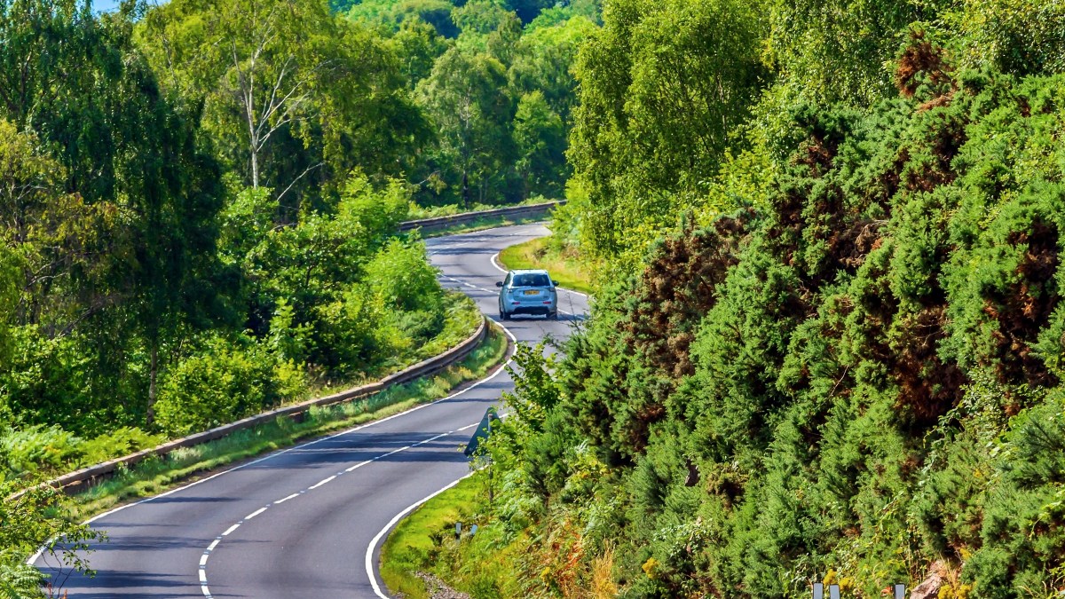 lone car on winding road