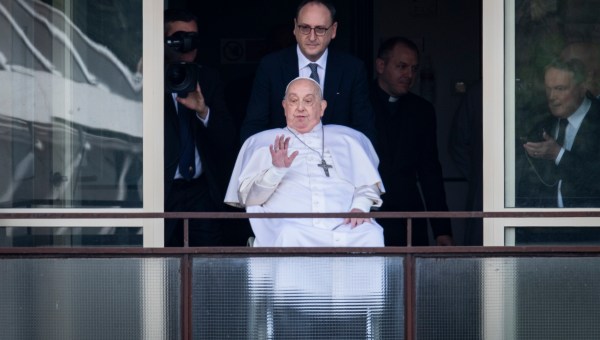 Pope Francis waves from a window of the Gemelli hospital before to be discharge after a five weeks hospitalization for pneumonia, in Rome on March 23, 2025.