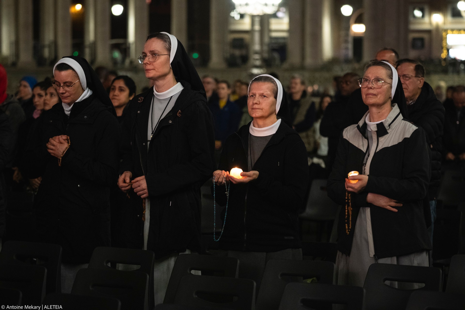 Nuns pray the rosary in St. Peter's Square at The Vatican, Friday, Mar. 14, 2025