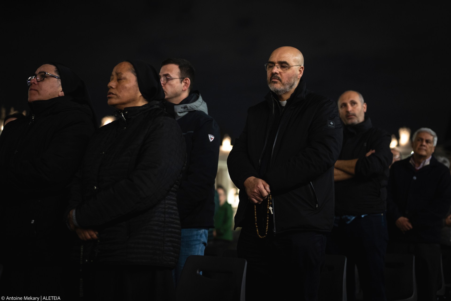 Faithful pray in St. Peter's Square, at the Vatican, during a vigil rosary for the recovery of Pope Francis, Saturday, March 15, 2025.