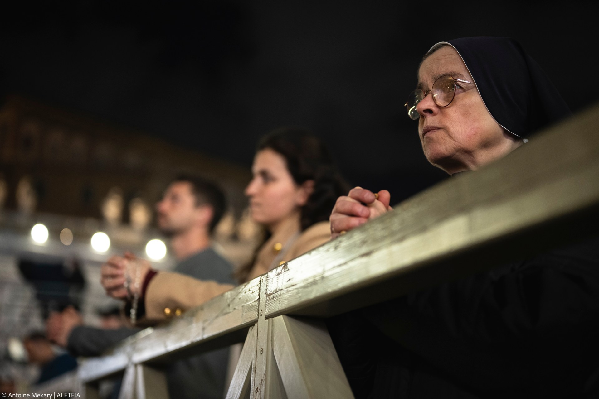 Faithful pray in St. Peter's Square, at the Vatican, during a vigil rosary for the recovery of Pope Francis, Saturday, March 15, 2025.