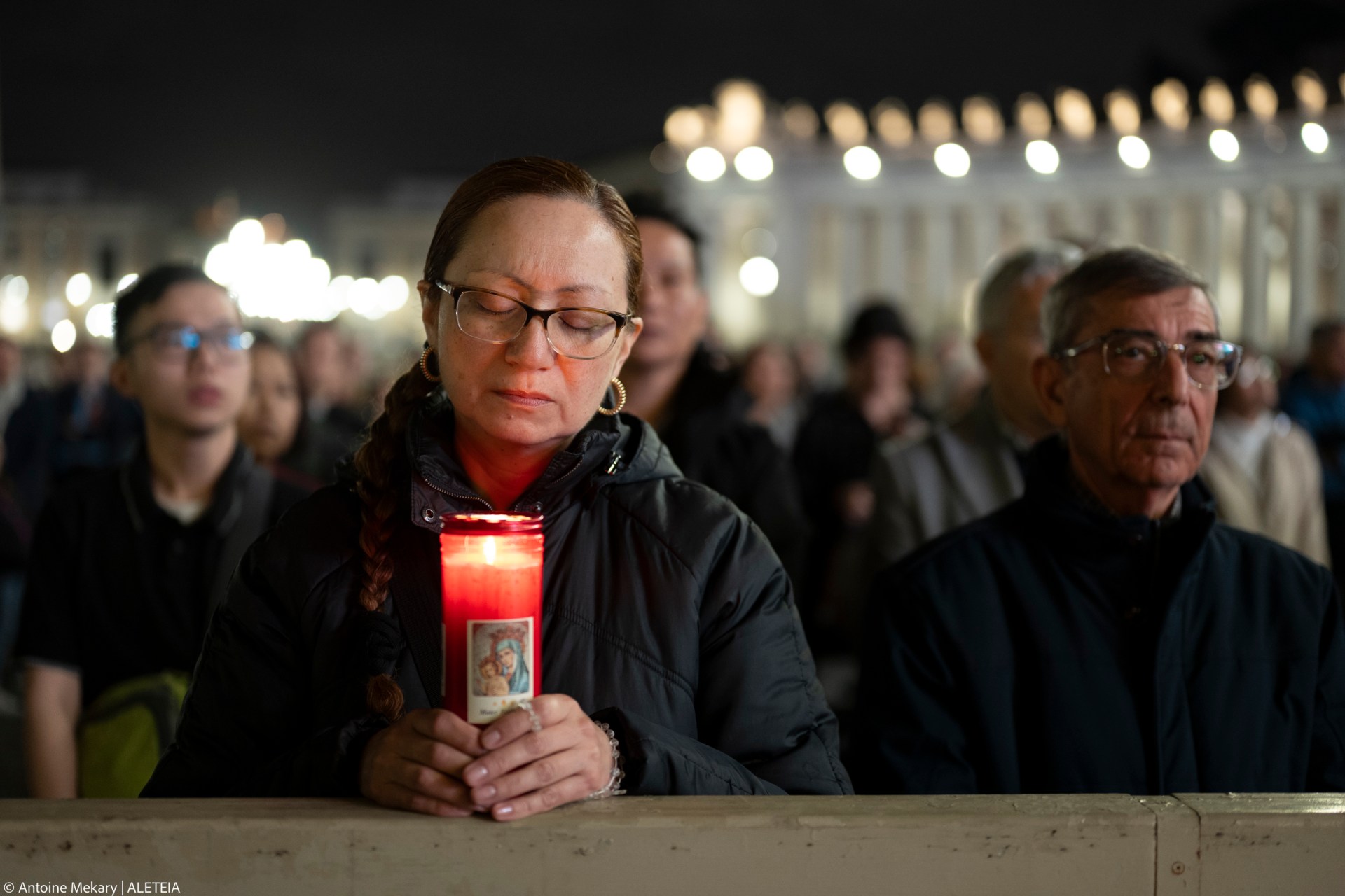 Faithful pray in St. Peter's Square, at the Vatican, during a vigil rosary for the recovery of Pope Francis, Saturday, March 15, 2025.