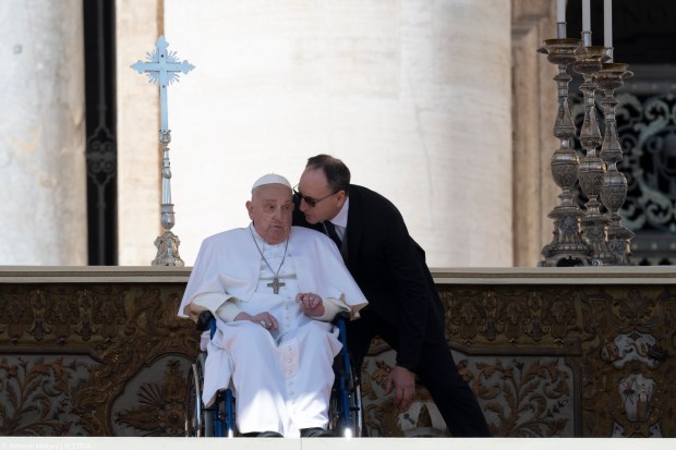 Pope Francis is pushed in a wheelchair on St. Peter's square to conduct the Angelus prayer in The Vatican, on April 6, 2025.