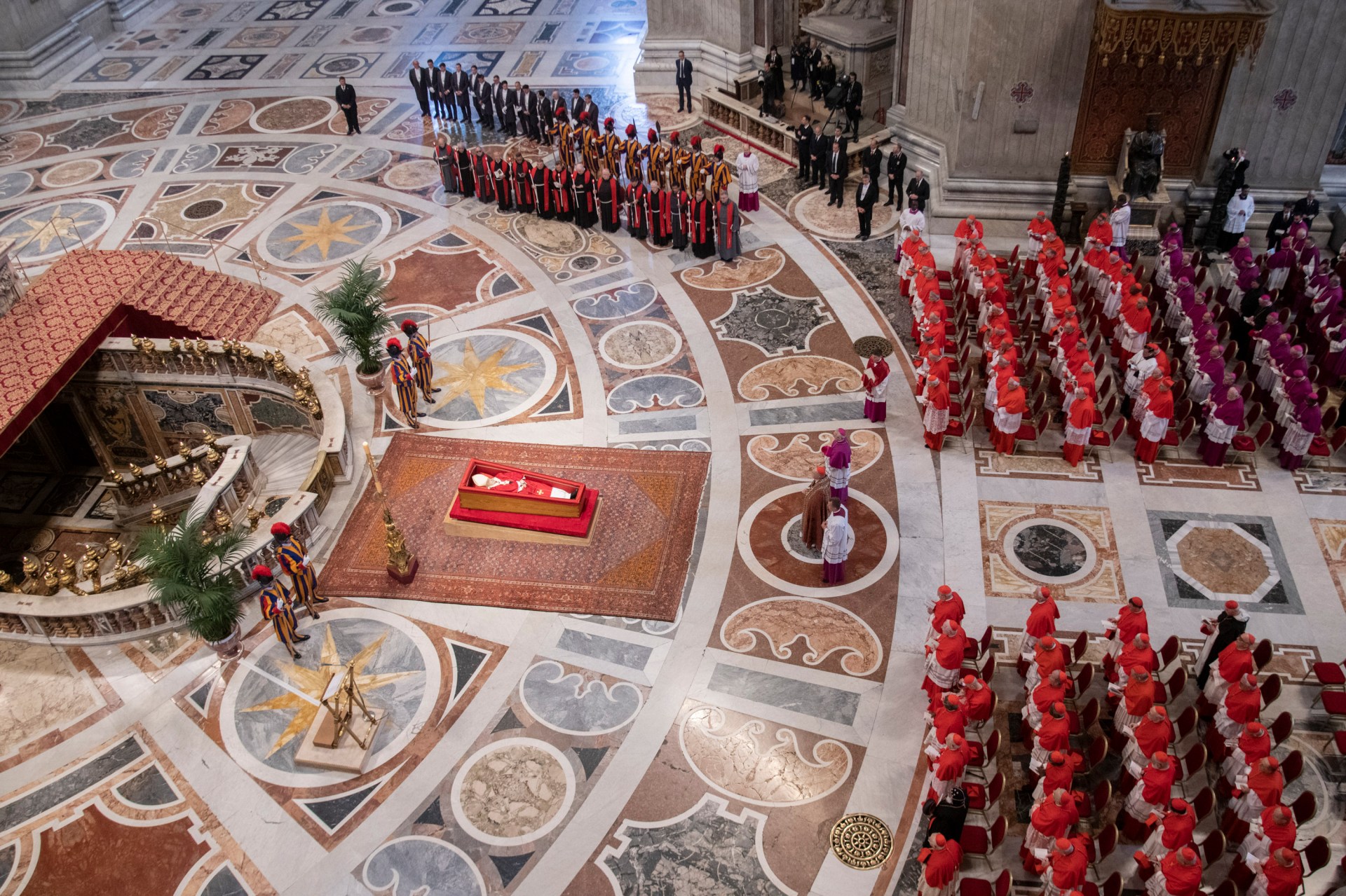 Pallbearers carry the coffin of the late Pope Francis inside St Peter's Basilica as it is transported in a procession from the chapel of Santa Marta to St Peter's Basilica, following the Pope's death, in the Vatican on April 23, 2025.