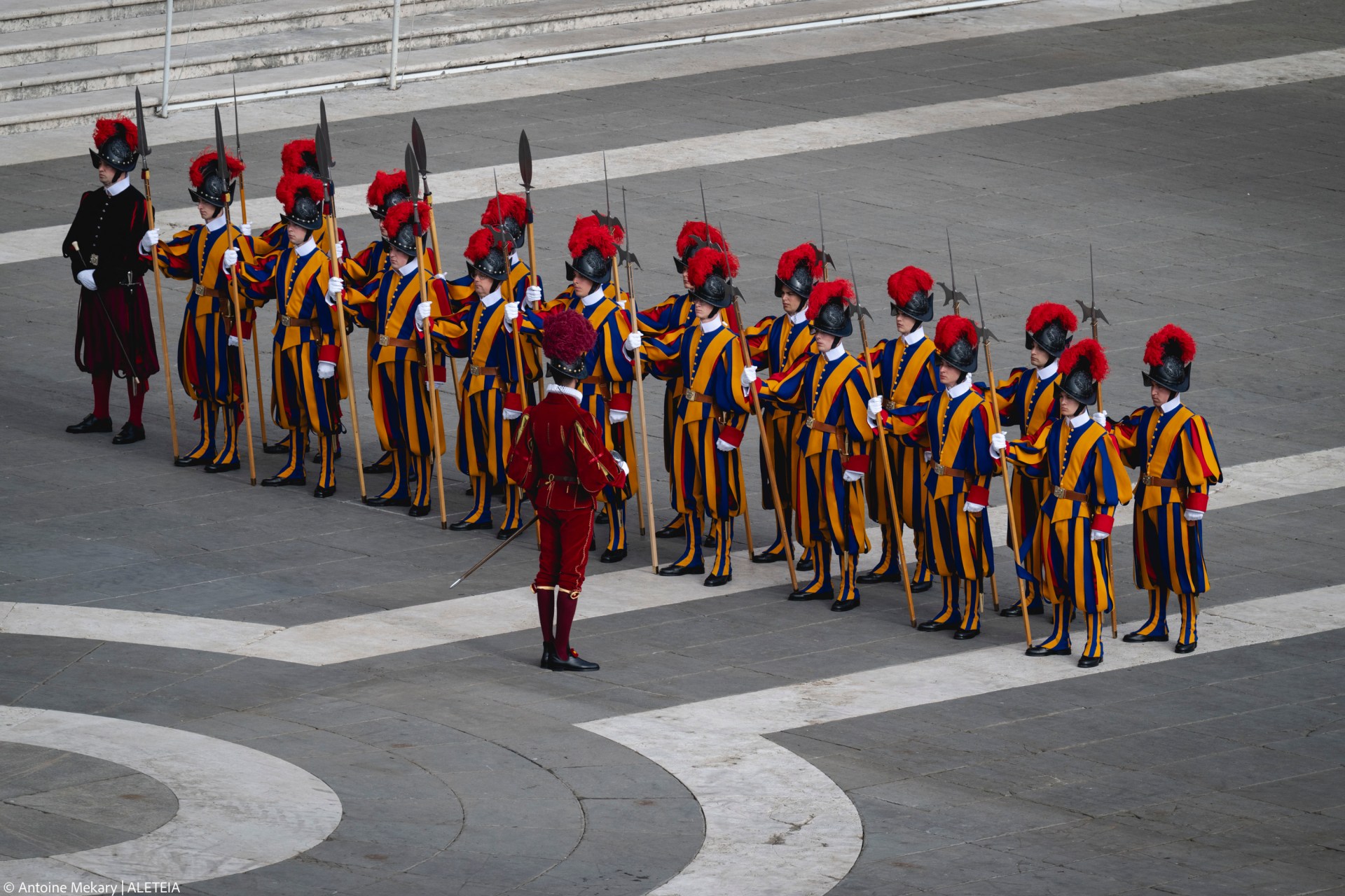 Swiss Guards stand in St. Peter’s Square during preparations for the arrival of the late Pope’s coffin