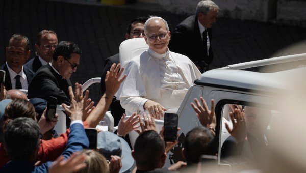 Pope Leo XIV waves to the crowd as he leaves on a popemobile after the weekly general audience at St Peter's Square at The Vatican, on May 28, 2025