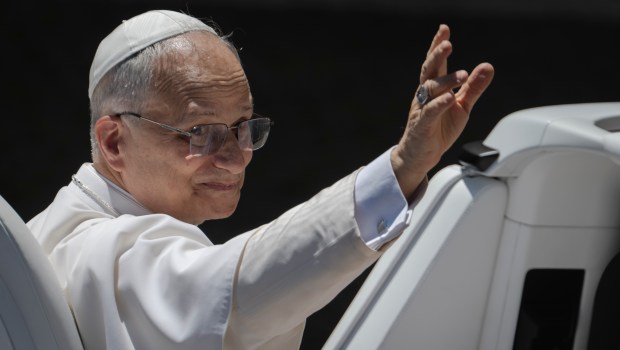 Pope Leo XIV waves to the crowd as he leaves on a popemobile after the weekly general audience at St Peter's Square at The Vatican, on May 28, 2025