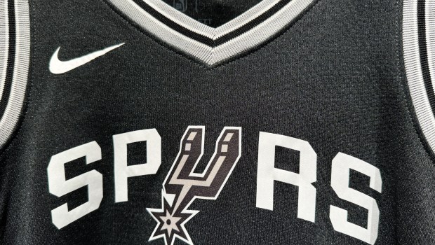 Spurs jersey with the logo.