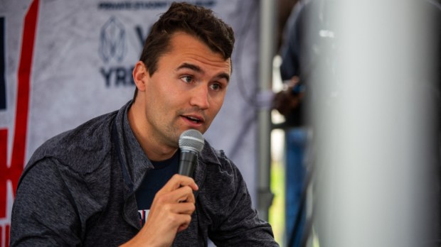 Charlie Kirk with a microphone