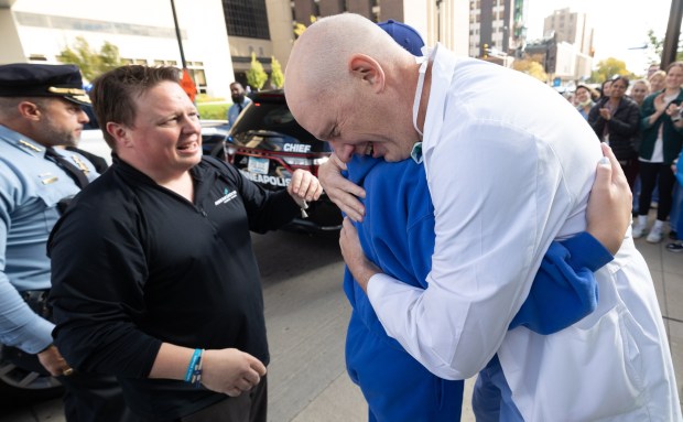 Girl hugging neurosurgeon
