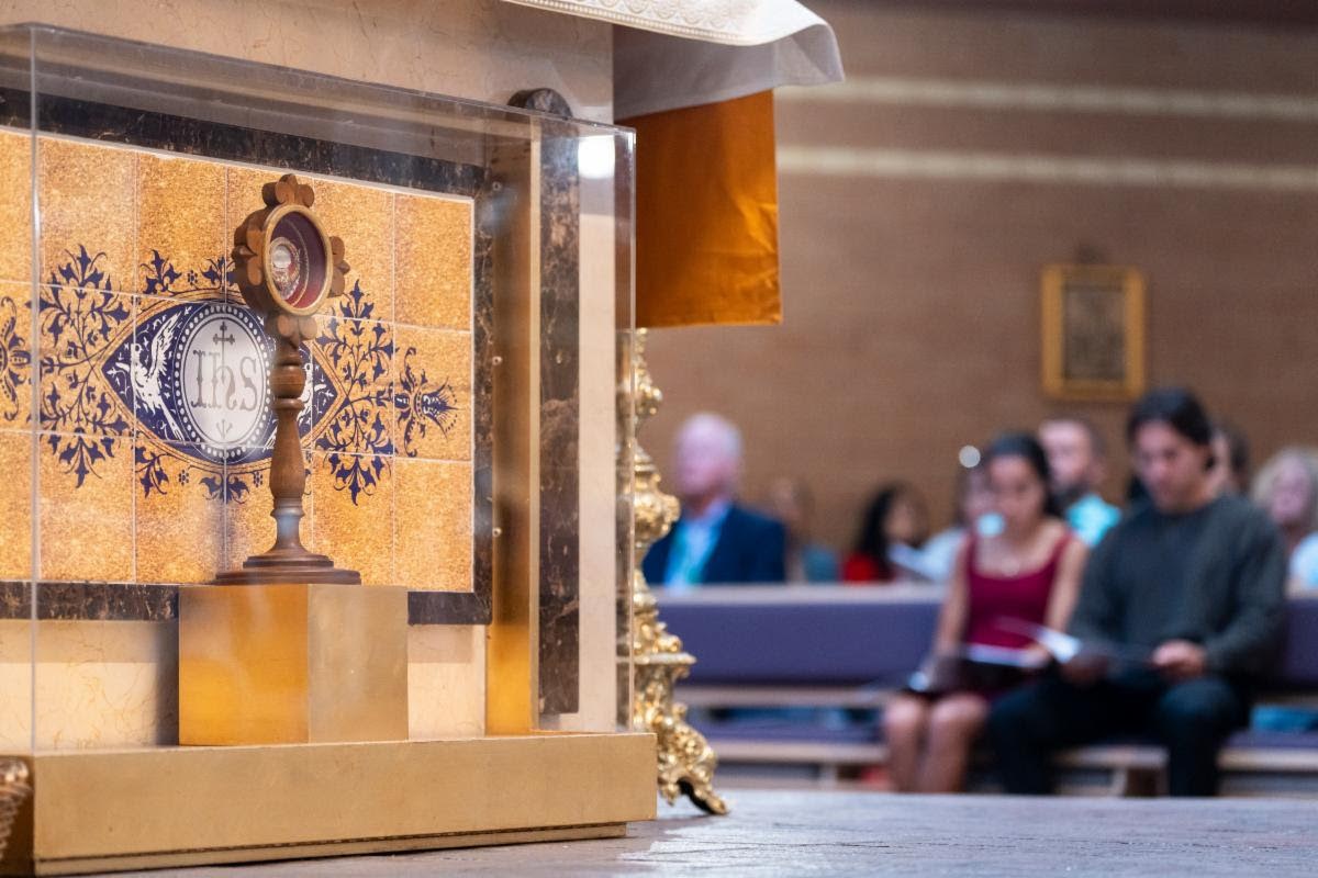 People praying by a relic