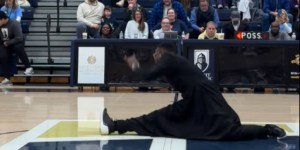 Watch: Priest brings down the house with dance at basketball game