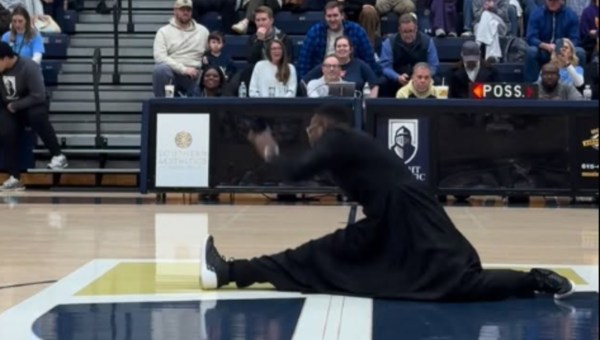 Priest doing a jazz split