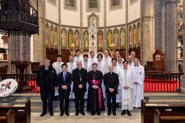 Archbishop Peter Chung Soon-taick center front row and key attendees take a commemorative photo after the Mass