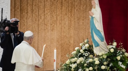 Pope lights candle for the sick before Our Lady of Lourdes