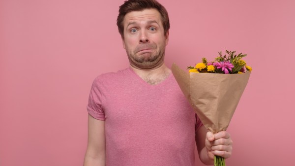 Sad lover or broken hearted man in pink