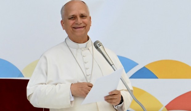 Corner Hero Image - Pope Leo laughs with young people, urges one virtue