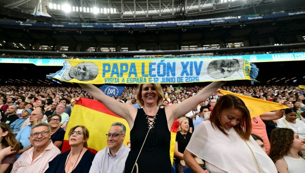 Spectators-cheer-as-Pope-Leo-XIV-arrives-at-Real-Madrids-Santiago-Bernabeu-stadium-in-Madrid