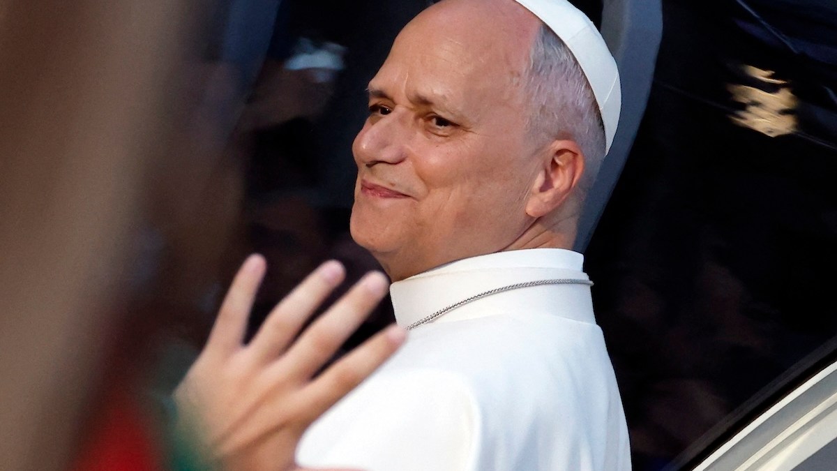 People wave to Pope Leo XIV on his way to lead a prayer vigil with young people in the Plaza de Lima in Madrid on June 6, 2026