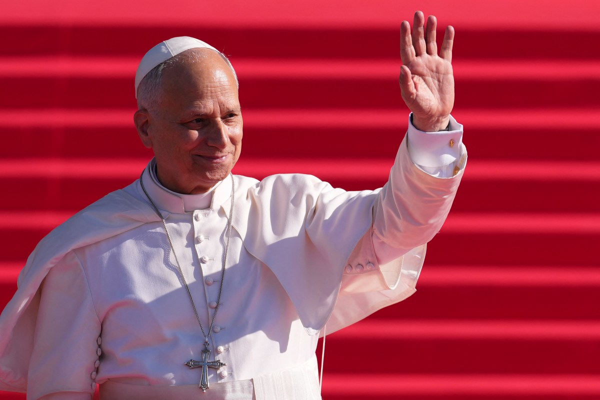 Pope Leo XIV waves as he leaves the Almudena Cathedral after leading prayer and devotion to Our Lady of Almudena in Madrid